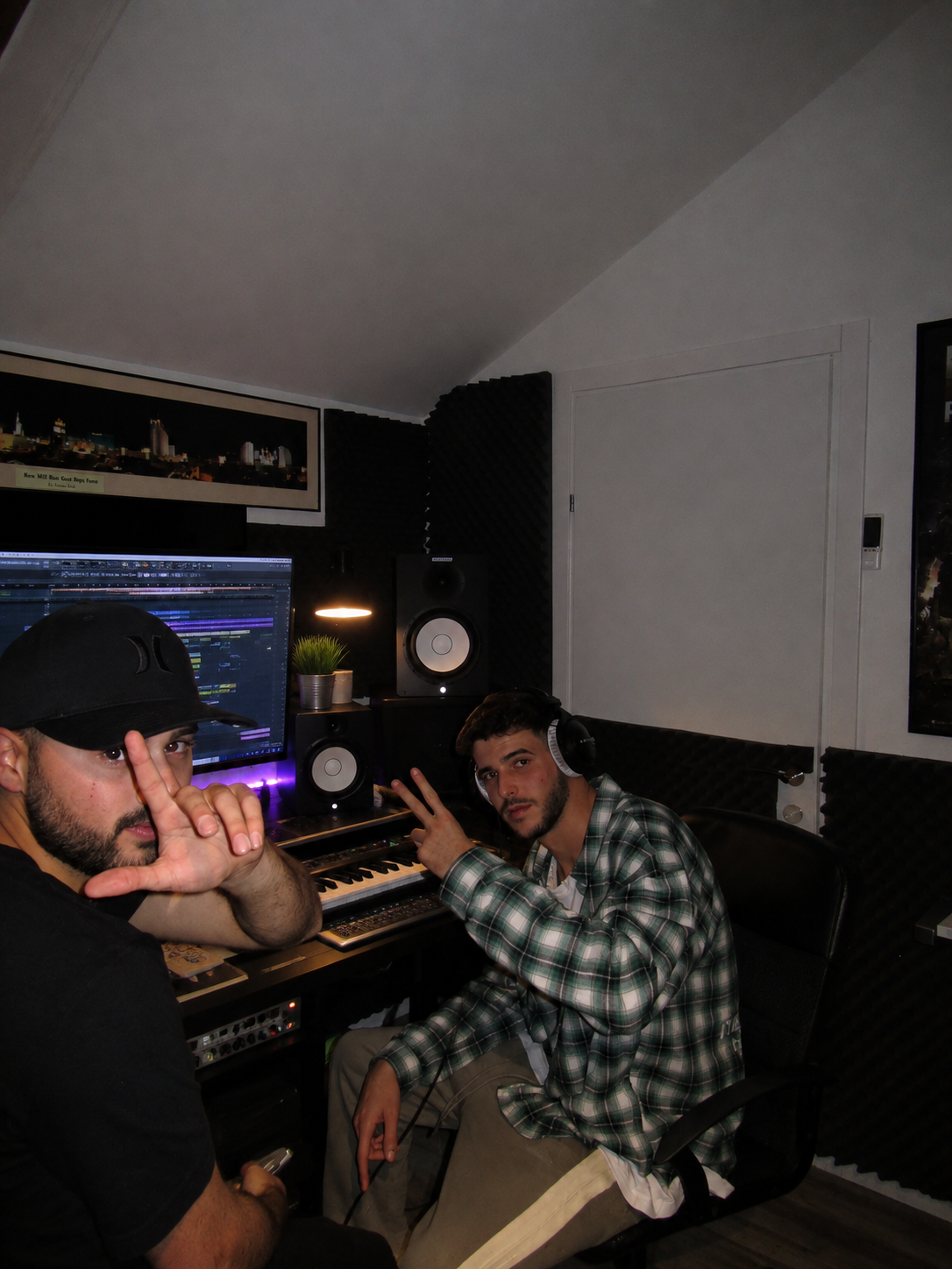 Two producers at the console during a session at Moore Productions